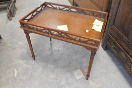 A reproduction galleried occasional table