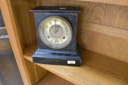 A vintage Ansonia Clock Co marble clock with brass face