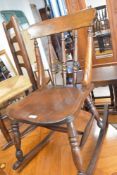 A modern reproduction spindle-back rocking chair, of traditional design, seat height 42cm