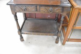 A priory style dark stained side table