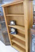 A set of modern golden oak bookshelves, dimensions approx. H180 W95 D30cm