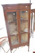 An Edwardian mahogany corner display