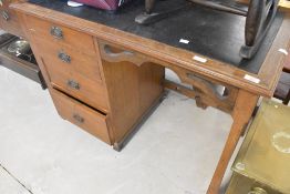 A late 19th Century oak Arts & Crafts style desk, width approx. 108cm
