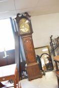 An 18th Century oak long cased clock having eight day movement and brass arched dial, named for