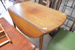 An early 20th Century Pembroke style drop leaf breakfast table with drawer to end, on square tapered