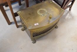 An antique brass coal bucket on paw feet, width approx. 47cm