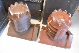 A pair of salt glazed ridge top bishop style chimney pots