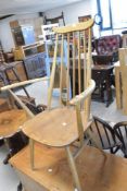 A traditional light Ercol Goldsmith carver chair
