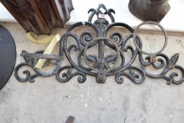 A vintage wrought iron plant pot holder/tether, width approx. 75cm