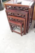 An Oriental hardwood nest of tables