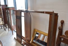 A traditional mahogany four poster bed frame