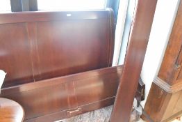 A modern mahogany sleigh bed