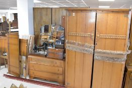 A vintage Old Charm style three piece bedroom suite in golden oak, comprising wardrobe, dressing