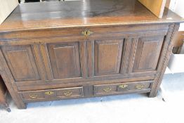 An 18th century and later oak mule chest or kist having four panels and twin drawers to base,