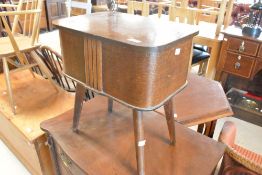 A vintage oak ply sewing box