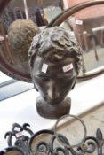 A life size plaster bust of a head, having bronze effect finish, height approx. 42cm