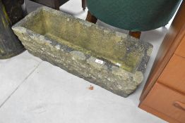 A concrete trough planter, width approx. 77cm