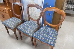A set of three Victorian mahogany balloon back dining chairs