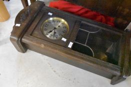 A 1920s/1930s oak cased wall clock