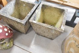 A pair of concrete garden planters, height approx. 37cm