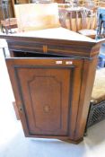 A 19th Century oak corner cupboard having inlaid decoration to door, height approx. 103cm