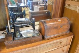 A Victorian Singer sewing machine (hand crank) in domed case