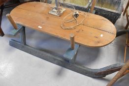 A large vintage wooden sled