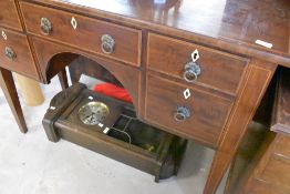 A 19th Century mahogany and inlaid side table or kneehole desk in the Regency style , width