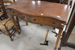 A reproduction Regency serpentine front side table