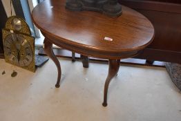 An early 20th Century oak and mahogany oval occasional/coffee table, approx. 67 x 45cm