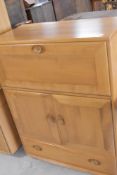 An Ercol light elm bureau/cocktail cabinet, dimensions approx. H110 W83 D44cm