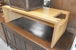 A vintage coffee table, having stepped undertier, width approx. 110cm