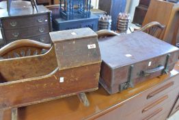 An Antique dolls crib and vintage suitcase