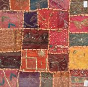 An attractive late 19th century patchwork coverlet fragment, constructed with blocks of material