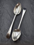 A pair of George III silver Old English pattern serving spoons, having decorative engraving to the