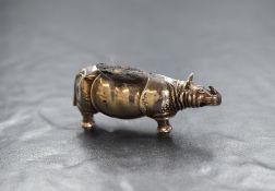 An early George V silver novelty pin cushion, modelled as a Sumatran rhinoceros having dark fabric
