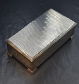 An Elizabeth II silver cigarette box, of hinged rectangular form, having engine turned decoration to