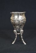 A Victorian silver footed vase, having a flared rim with embossed floral and bow decoration,