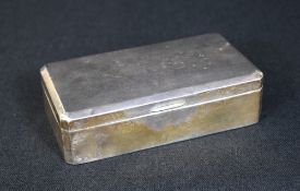 An Elizabeth II silver cigarette box, of hinged rectangular form, having canted corners with