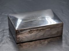 A 20th century silver cigarette box, of hinged rectangular form having 'SI' monogram to lid, with