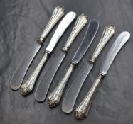 A cased set of six George V silver handled knives, having embossed decoration to the handles and