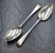 A pair of William IV silver Old English pattern serving spoons, having a griffin heraldic crest to