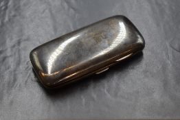 A Victorian silver cigar case of hinged rectangular form curved for the gentleman's pocket marks for