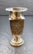 A continental white metal vase, of square fluted form having a textured flared rim, embossed