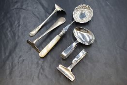 A pair of Elizabeth II silver child's food pusher and spoon, of traditional form with curved