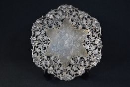 A George VI silver pedestal salver, of hexagonal form having a pierced grape vine motif with a