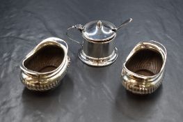 A pair of Edwardian silver salts, of oval form having flared rims with half gadrooned bodies,