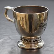 A 20th century silver cup, of circular form having decorative pierced handle with personalised