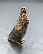 An early 20th century silver novelty pin cushion, modelled as a cockatoo having dark fabric to the