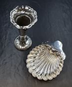 A late Edwardian silver scallop dish, raised on three ball feet, marks for London 1909, maker Josiah